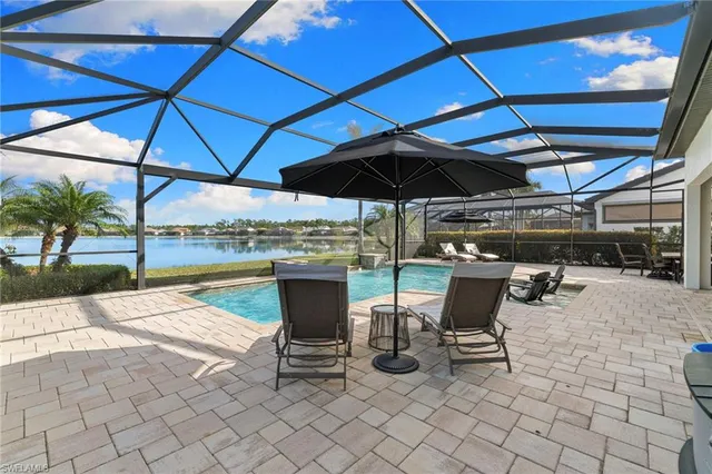 a view of a backyard with sitting area
