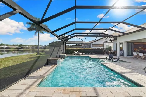 a view of a swimming pool with a patio