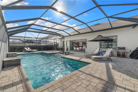 a view of a backyard with seating area