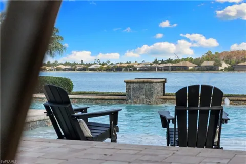 a view of a chairs and table in the patio