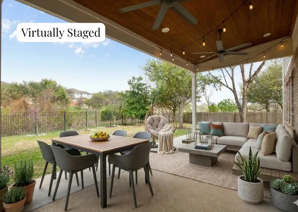 a view of a patio with a table and chairs