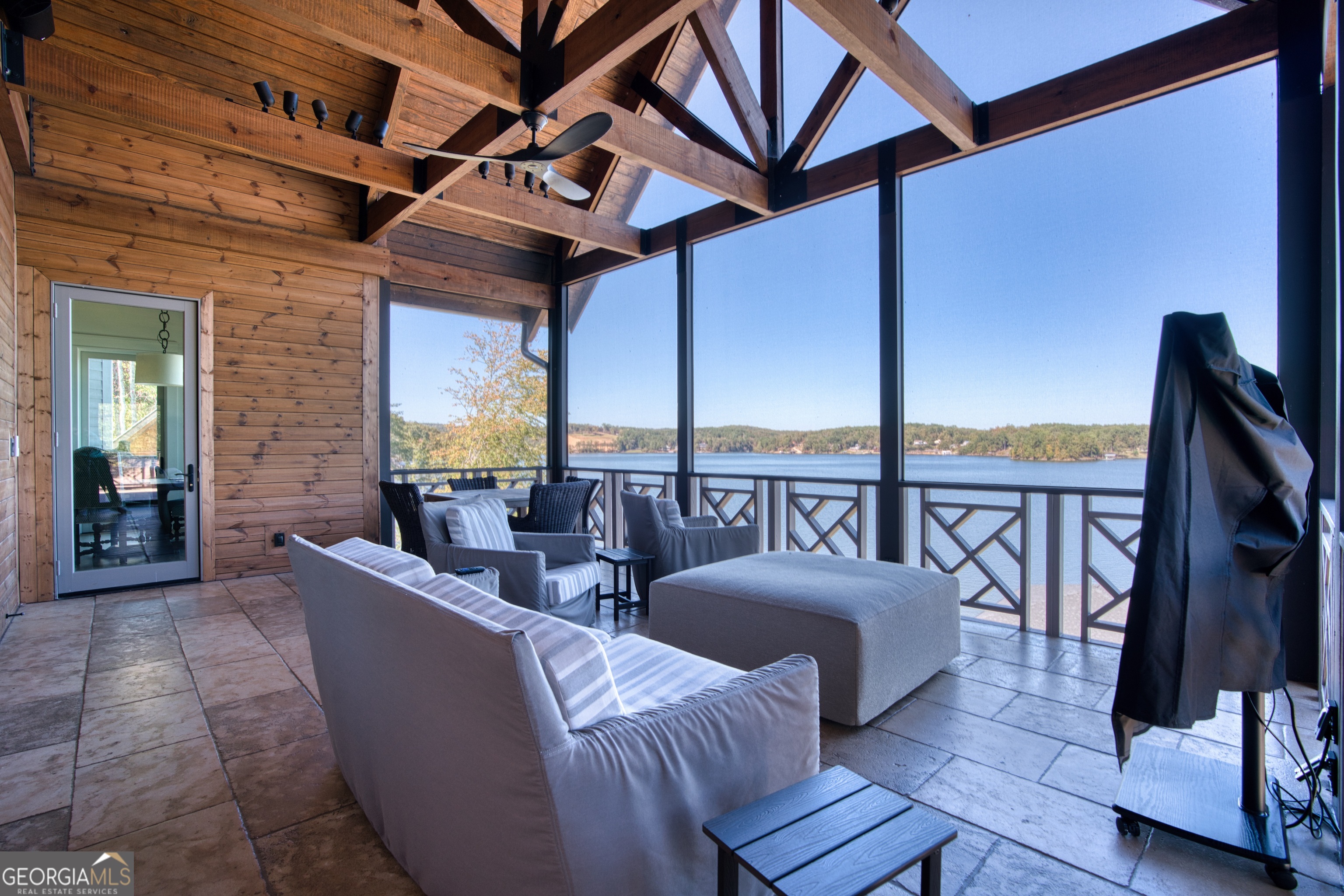 144 Co Road Leesburg, AL 35983 - Photo 30 of 109 a living room with furniture a floor to ceiling window and a flat screen tv