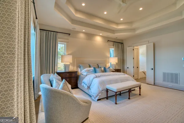 a living room with furniture and a projector