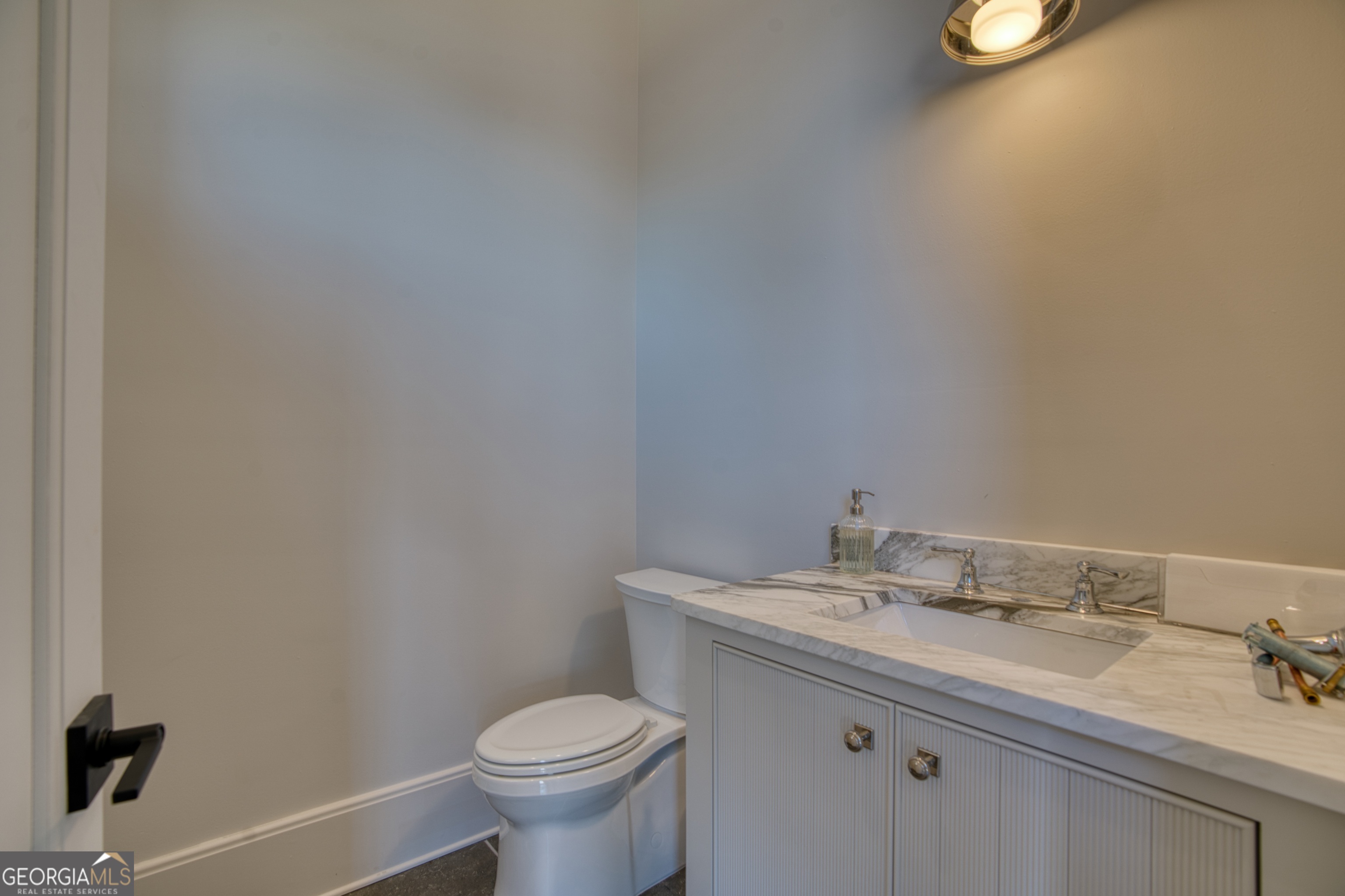 144 Co Road Leesburg, AL 35983 - Photo 84 of 109 a bathroom with a granite countertop sink and a toilet
