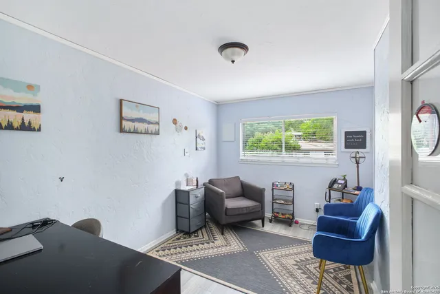 a living room with granite countertop furniture and a dining table