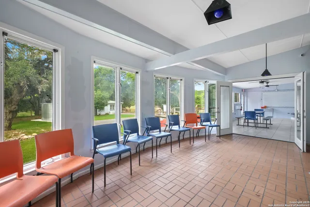 a view of a livingroom with furniture and a flat screen tv