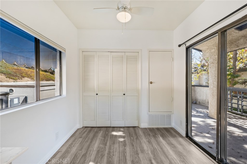 5712 Skyview Way, Unit A Agoura Hills, CA 91301 - Photo 13 of 31 a view of a room with wooden floor and windows