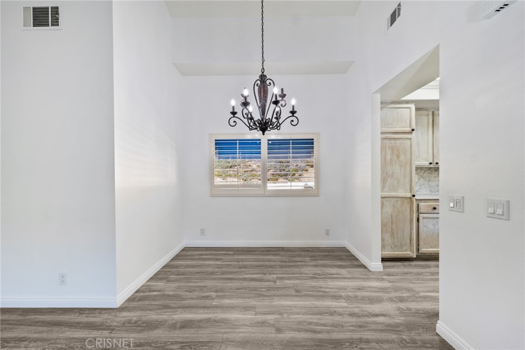5712 Skyview Way, Unit A Agoura Hills, CA 91301 - Photo 15 of 31 a view of a room with wooden floor closet and windows