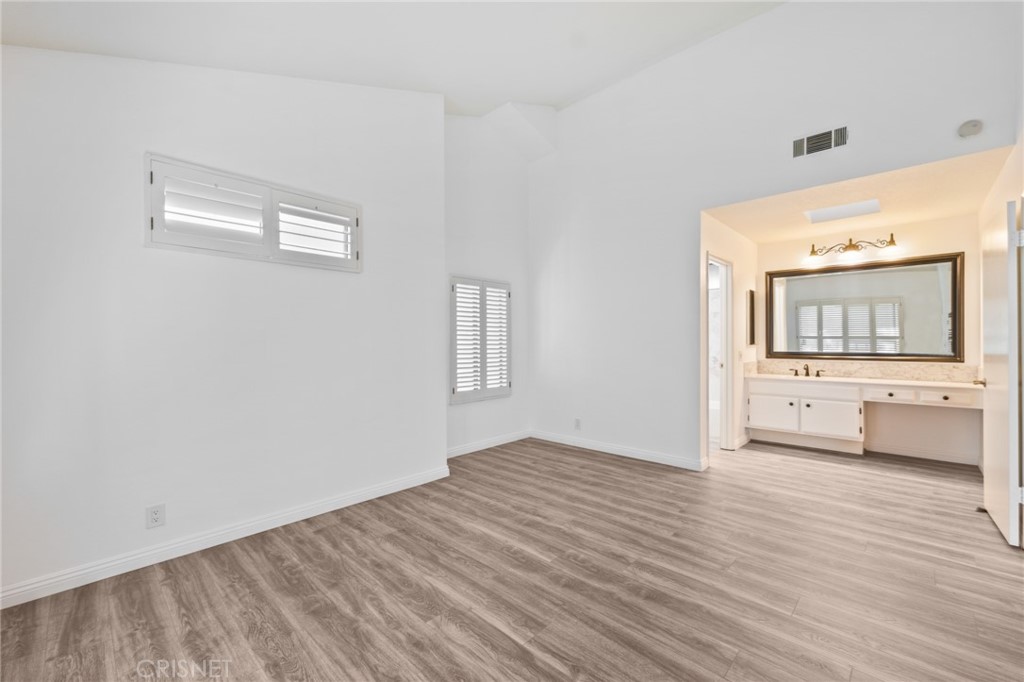 5712 Skyview Way, Unit A Agoura Hills, CA 91301 - Photo 18 of 31 a view of a big room with wooden floor and a window