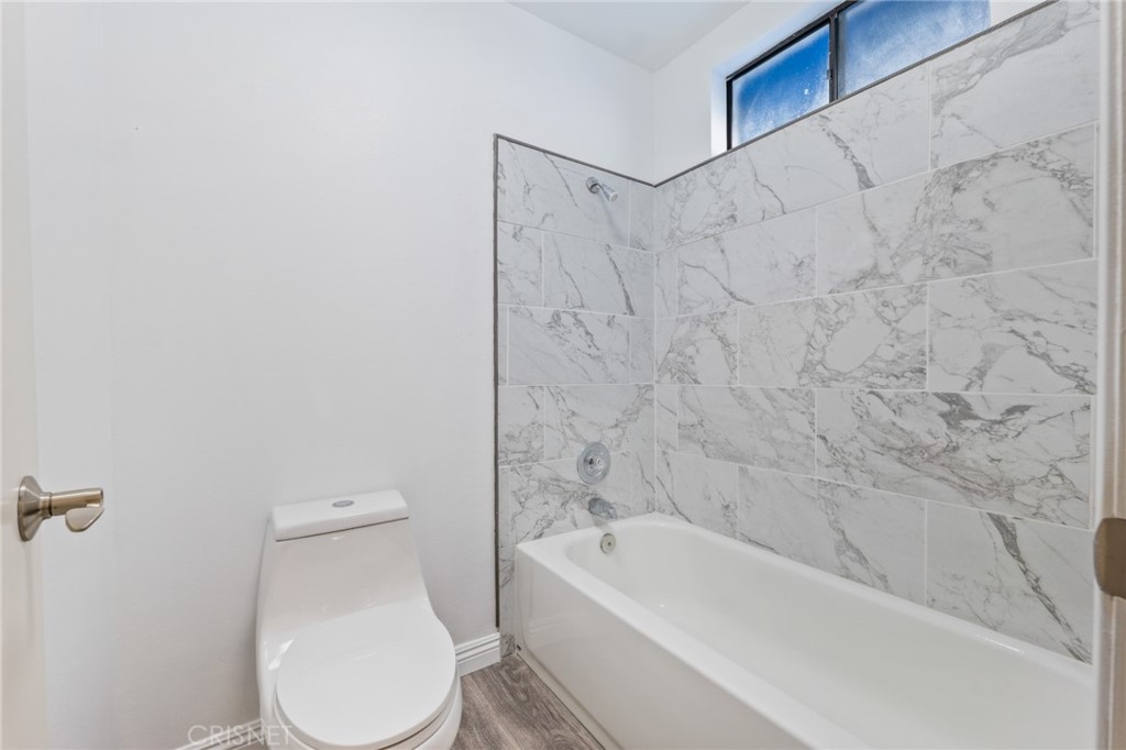 5712 Skyview Way, Unit A Agoura Hills, CA 91301 - Photo 22 of 31 a bathroom with a toilet and a bathtub