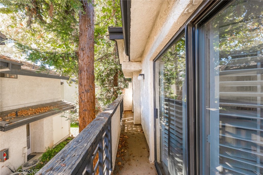 5712 Skyview Way, Unit A Agoura Hills, CA 91301 - Photo 30 of 31 a view of a balcony with wooden floor