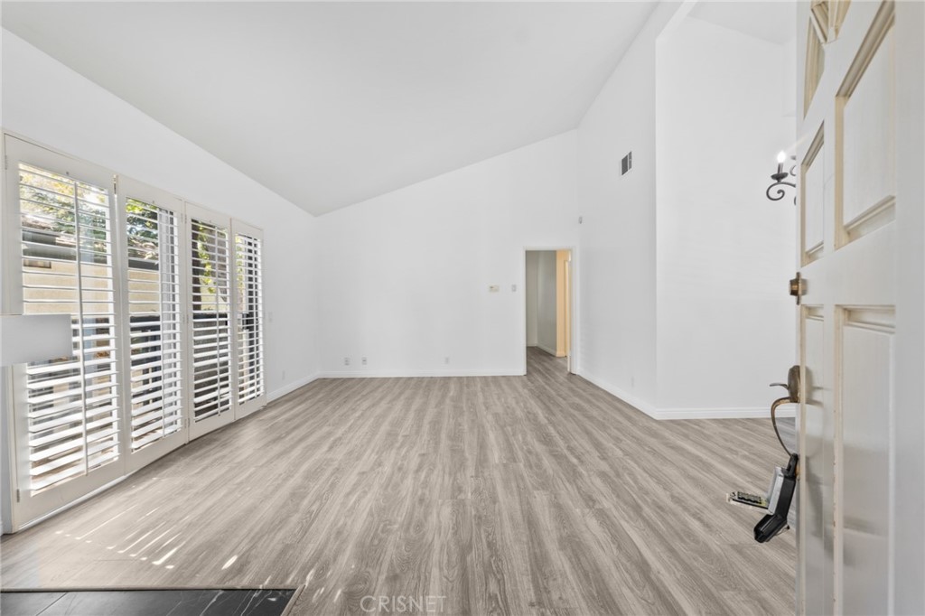 5712 Skyview Way, Unit A Agoura Hills, CA 91301 - Photo 4 of 31 a view of a room with wooden floor and windows