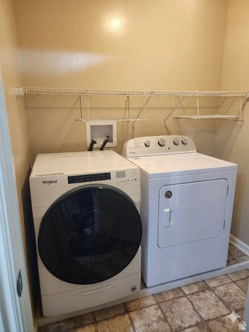 2525 West 450 South, Unit 8 Springville, UT 84663 - Photo 16 of 22 Dedicated laundry area featuring a front-loading washing machine and dryer