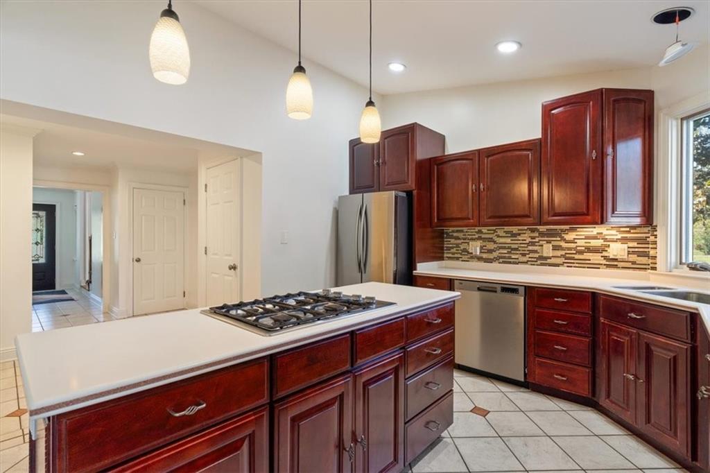 201 Dorseyville Road Pittsburgh, PA 15215 - Photo 11 of 40 a kitchen with stainless steel appliances granite countertop wooden cabinets a stove a sink and a oven