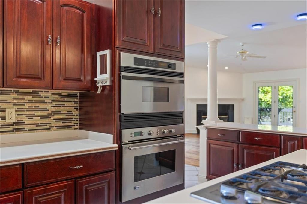 201 Dorseyville Road Pittsburgh, PA 15215 - Photo 12 of 40 a kitchen with granite countertop a stove cabinets and microwave