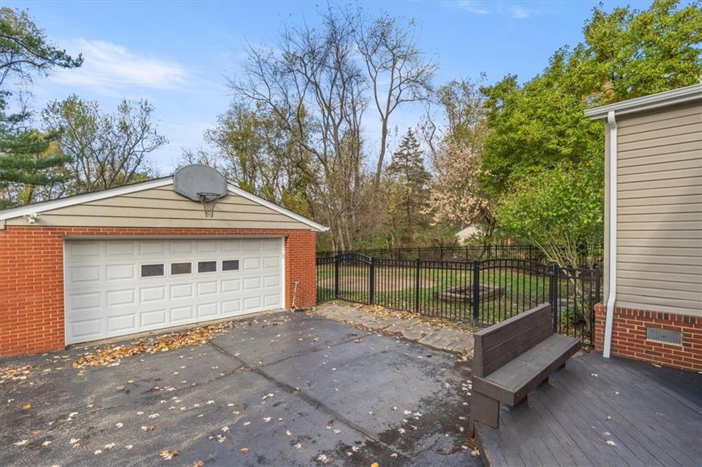 201 Dorseyville Road Pittsburgh, PA 15215 - Photo 34 of 40 a view of a garage with a tree