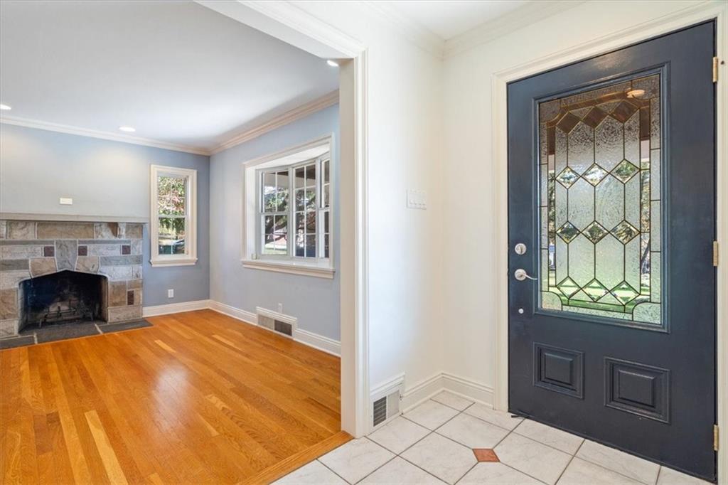 201 Dorseyville Road Pittsburgh, PA 15215 - Photo 4 of 40 a bedroom with a bed and a fireplace