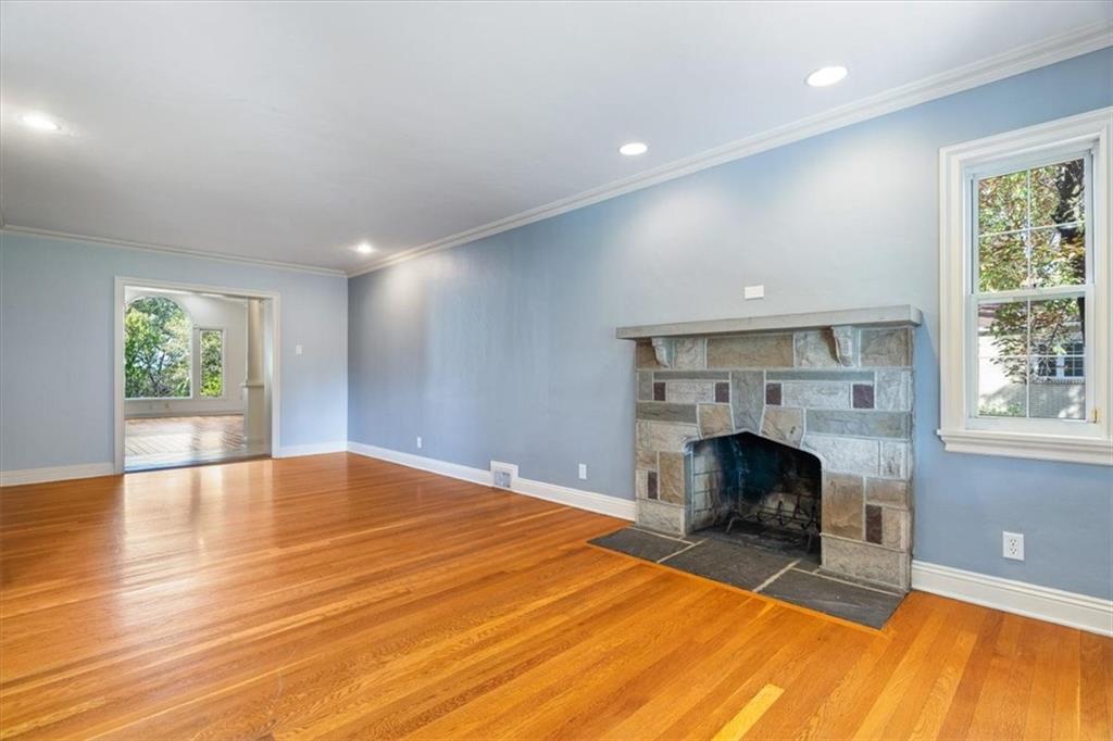 201 Dorseyville Road Pittsburgh, PA 15215 - Photo 5 of 40 a view of an empty room with a fireplace and a window