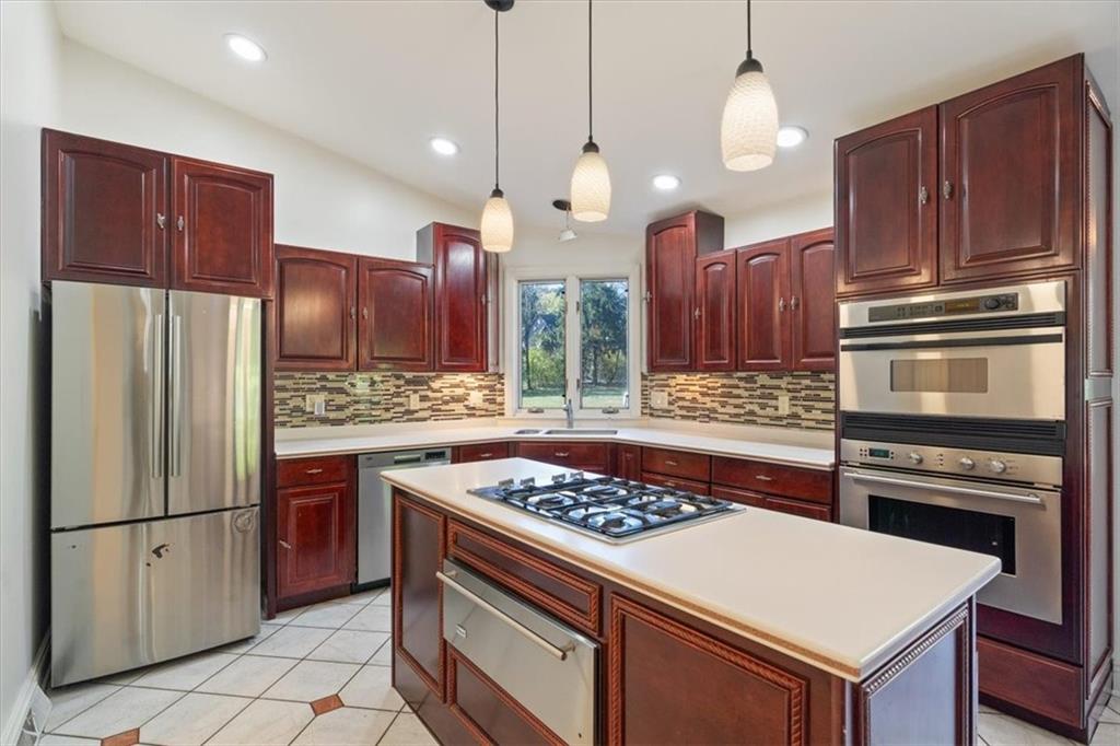 201 Dorseyville Road Pittsburgh, PA 15215 - Photo 10 of 40 a kitchen with a stove a refrigerator and a sink