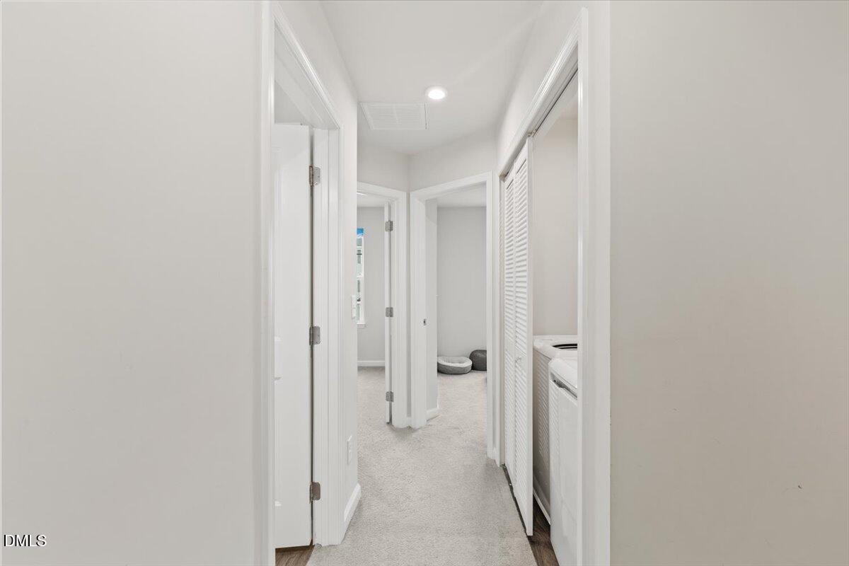 8721 Red Canyon Way Raleigh, NC 27616 - Photo 11 of 29 a view of a hallway with wooden floor