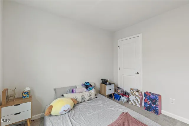 a bedroom with furniture and a wooden floor