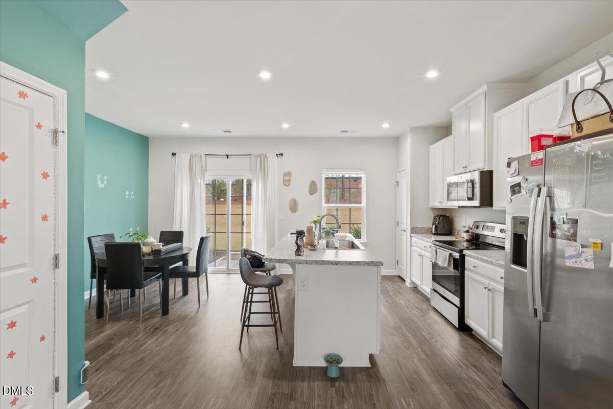 8721 Red Canyon Way Raleigh, NC 27616 - Photo 3 of 29 a view of a kitchen and dining room