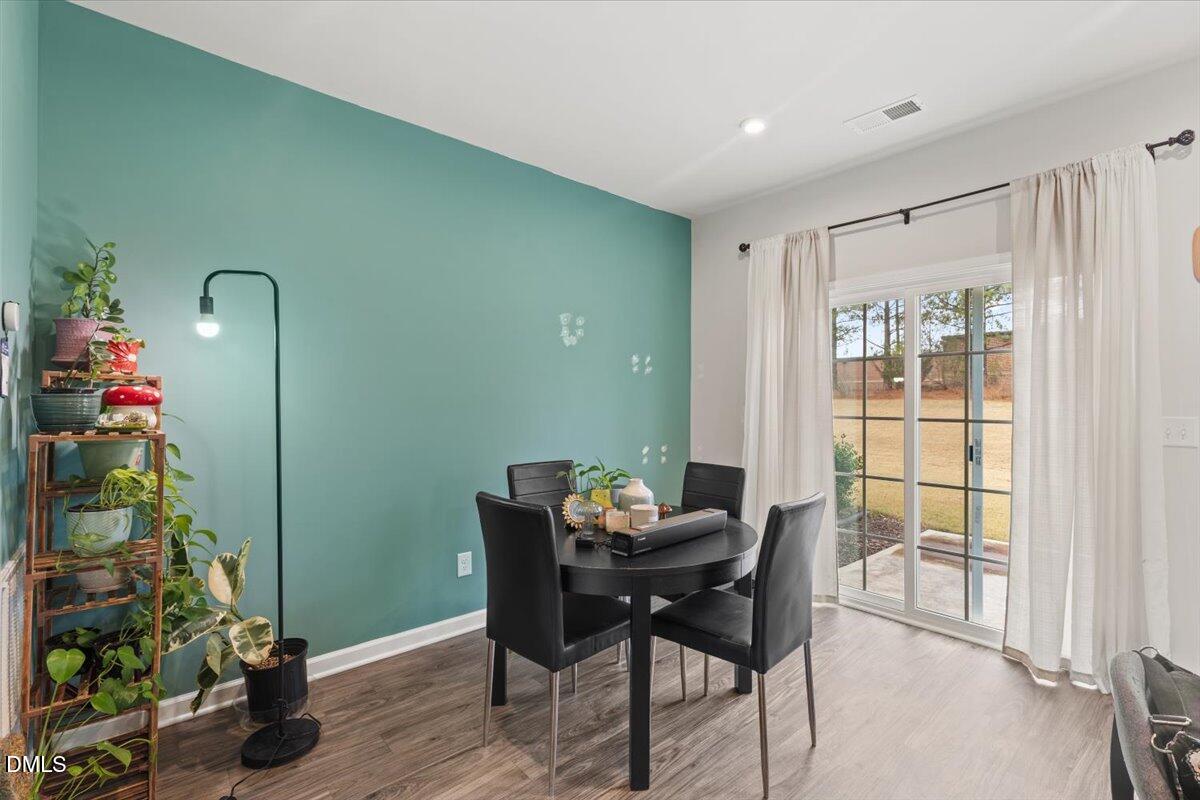 8721 Red Canyon Way Raleigh, NC 27616 - Photo 8 of 29 a workspace with furniture and a potted plant