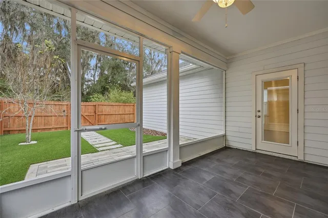 a view of an entryway with backyard