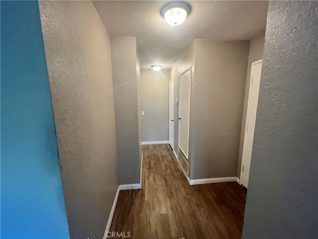 600 Central Avenue, Unit 302 Riverside, CA 92507 - Photo 12 of 27 a view of hallway with wooden floor