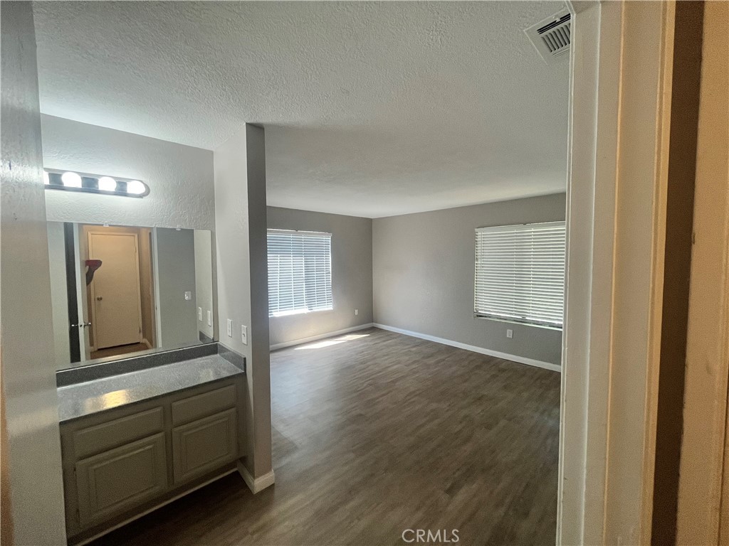 600 Central Avenue, Unit 302 Riverside, CA 92507 - Photo 19 of 27 a view of an entryway with wooden floor