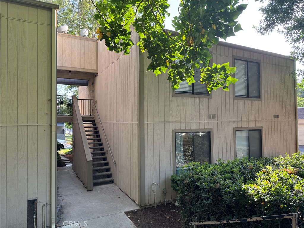 600 Central Avenue, Unit 302 Riverside, CA 92507 - Photo 25 of 27 a house with potted plant in front of it