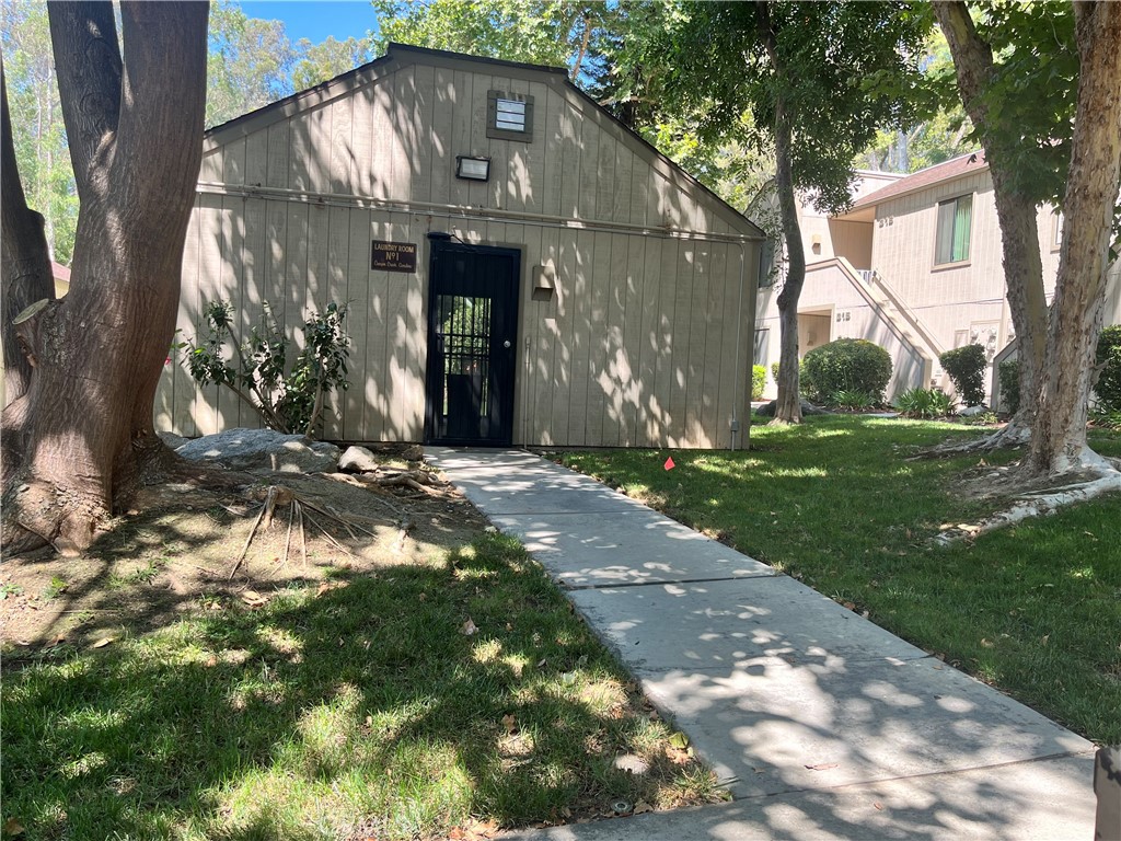 600 Central Avenue, Unit 302 Riverside, CA 92507 - Photo 26 of 27 a view of a house with a yard