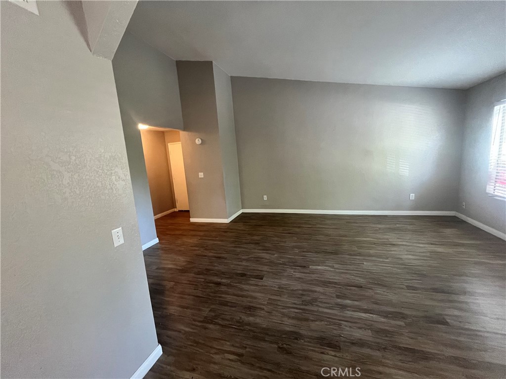600 Central Avenue, Unit 302 Riverside, CA 92507 - Photo 7 of 27 wooden floor in an empty room