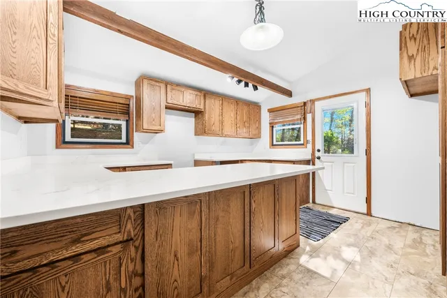a view of entryway with kitchen