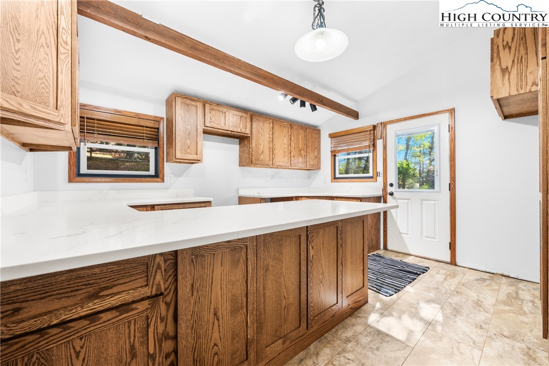 615 Sampson Road Boone, NC 28607 - Photo 12 of 36 a kitchen with stainless steel appliances granite countertop a refrigerator and a sink