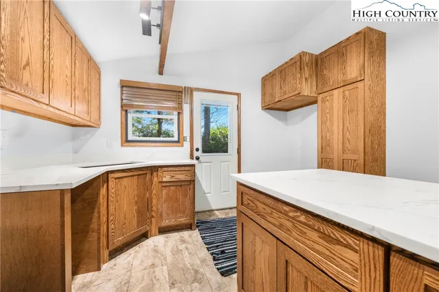 a view of a big room with windows