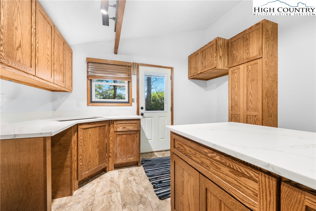615 Sampson Road Boone, NC 28607 - Photo 14 of 36 a kitchen with a sink a stove and a refrigerator