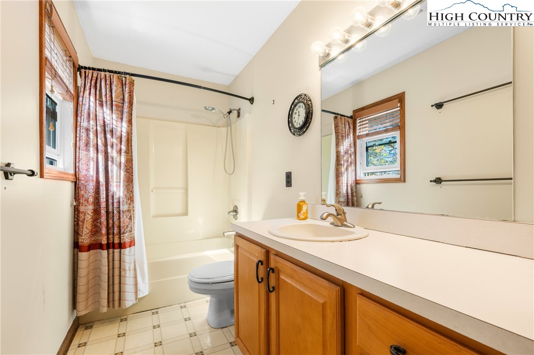 615 Sampson Road Boone, NC 28607 - Photo 17 of 36 a bathroom with a sink a toilet and shower