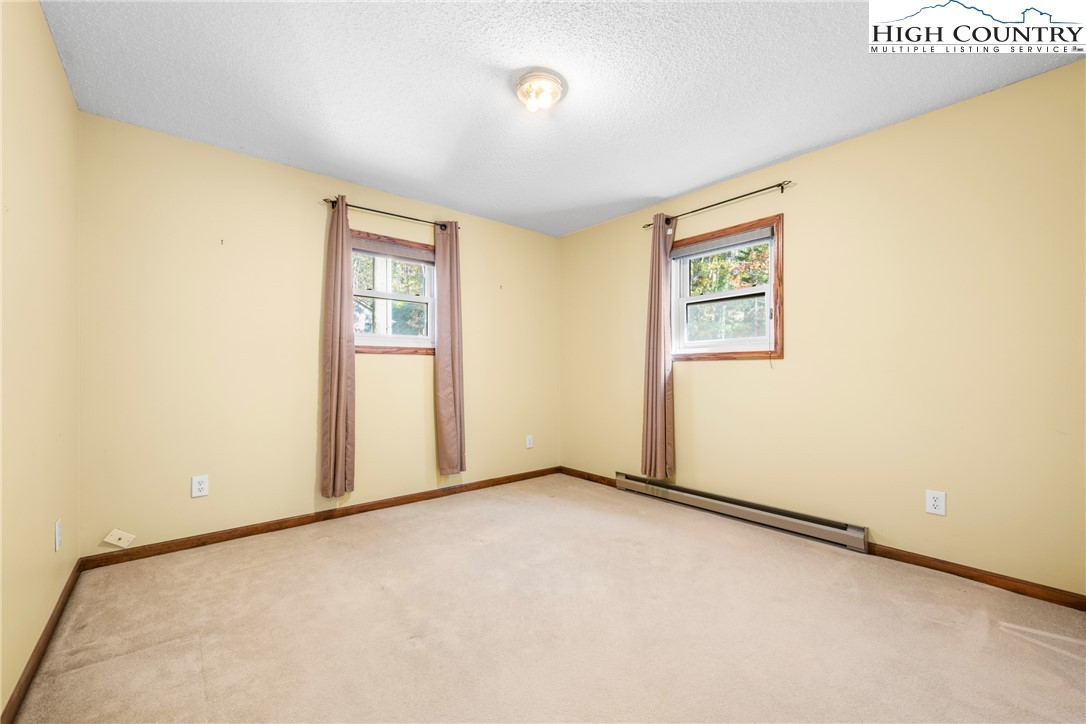 615 Sampson Road Boone, NC 28607 - Photo 22 of 36 an empty room with windows