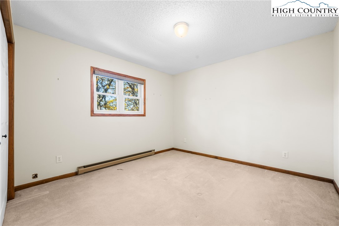 615 Sampson Road Boone, NC 28607 - Photo 24 of 36 an empty room with a window