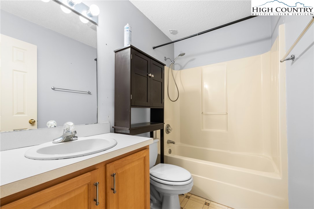 615 Sampson Road Boone, NC 28607 - Photo 27 of 36 a bathroom with a sink toilet and shower