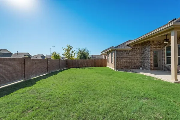 a backyard of a house with lots of green space