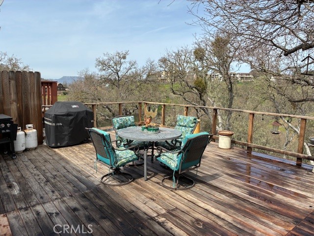 2377 Comanche Way Paso Robles, CA 93446 - Photo 18 of 33 a roof deck with table and chairs and wooden floor