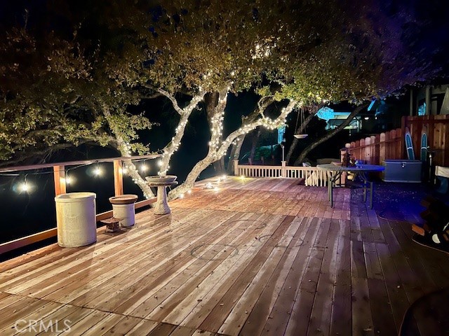 2377 Comanche Way Paso Robles, CA 93446 - Photo 32 of 33 a view of a patio with dining table and chairs with wooden floor and fence