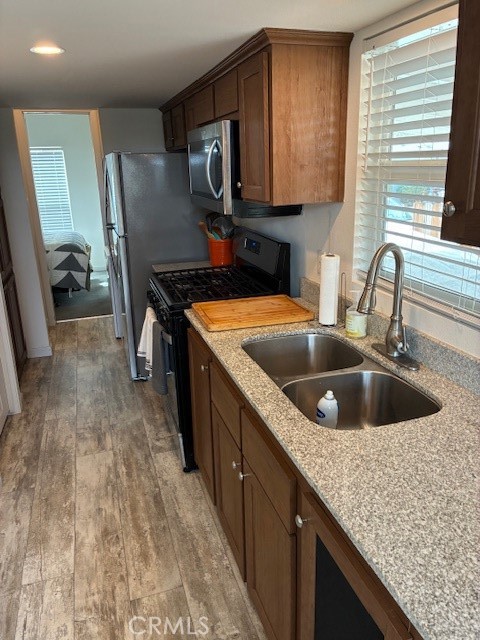2377 Comanche Way Paso Robles, CA 93446 - Photo 6 of 33 a kitchen with a stove sink and cabinets