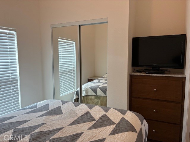 2377 Comanche Way Paso Robles, CA 93446 - Photo 7 of 33 a bedroom with a bed and a flat screen tv