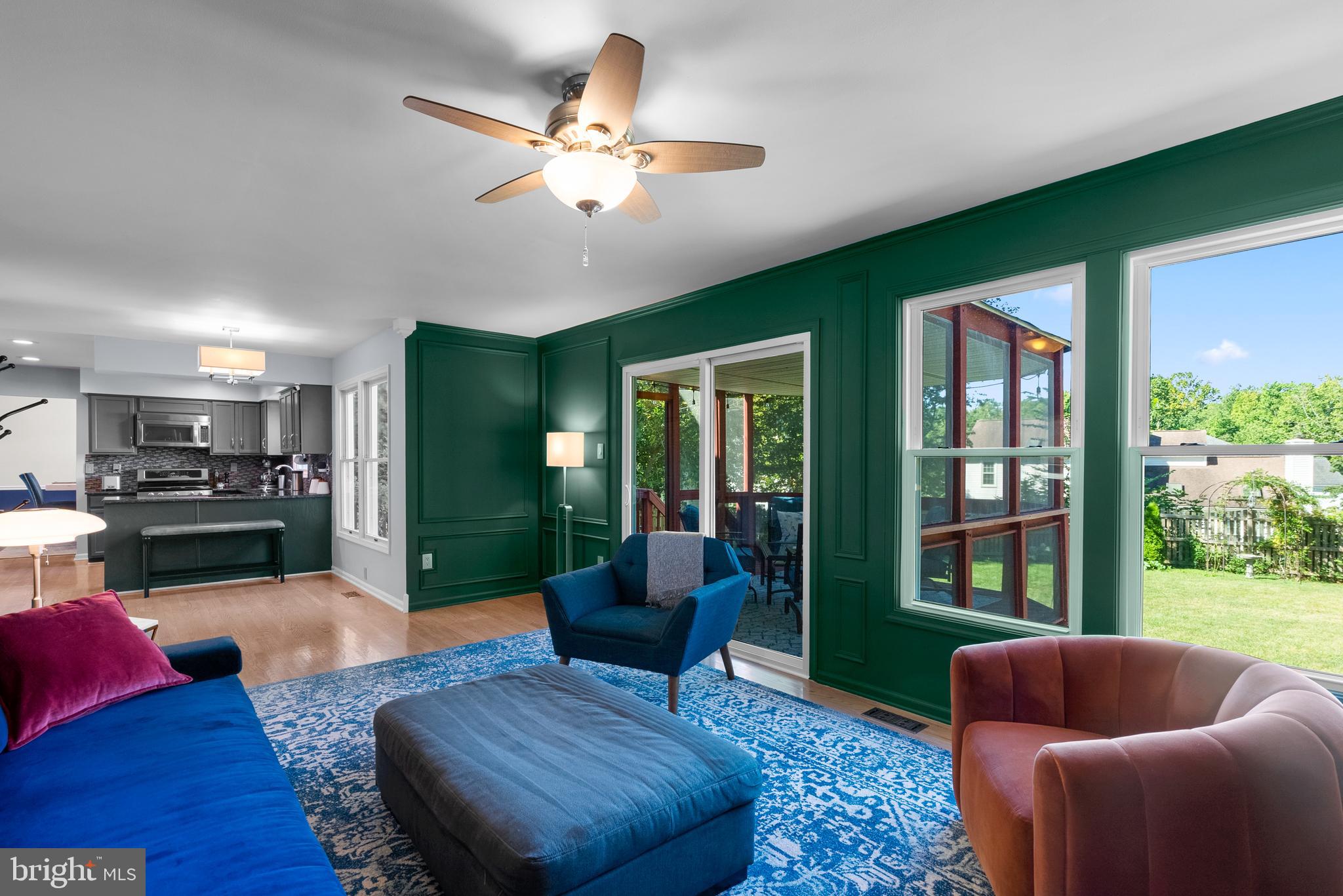 1949 Autumn Ridge Circle Silver Spring, MD 20906 - Photo 12 of 27 a living room with furniture fireplace and a large window
