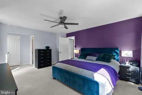 a bedroom with a bed and a closet