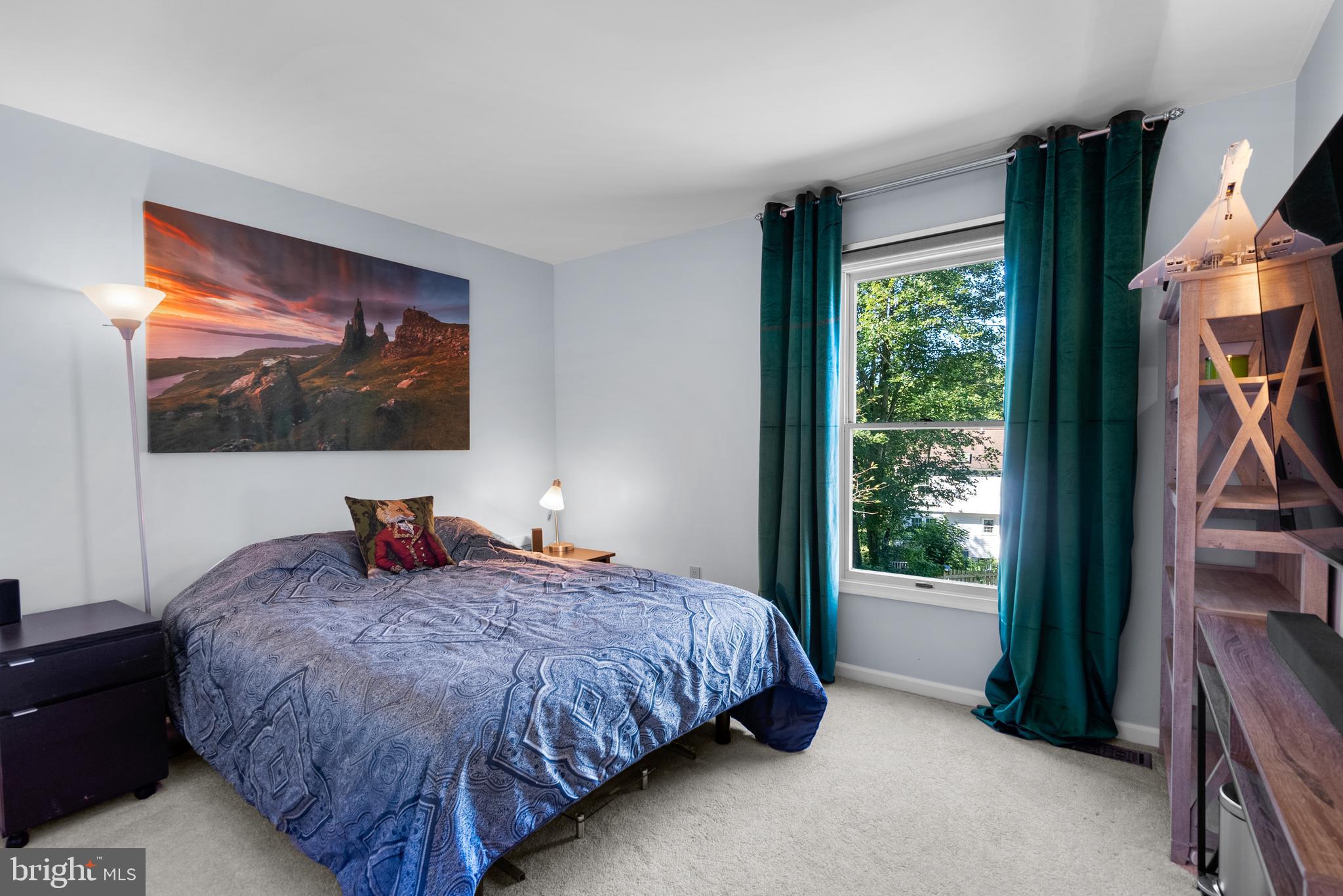 1949 Autumn Ridge Circle Silver Spring, MD 20906 - Photo 19 of 27 a bedroom with a bed and a flat screen tv