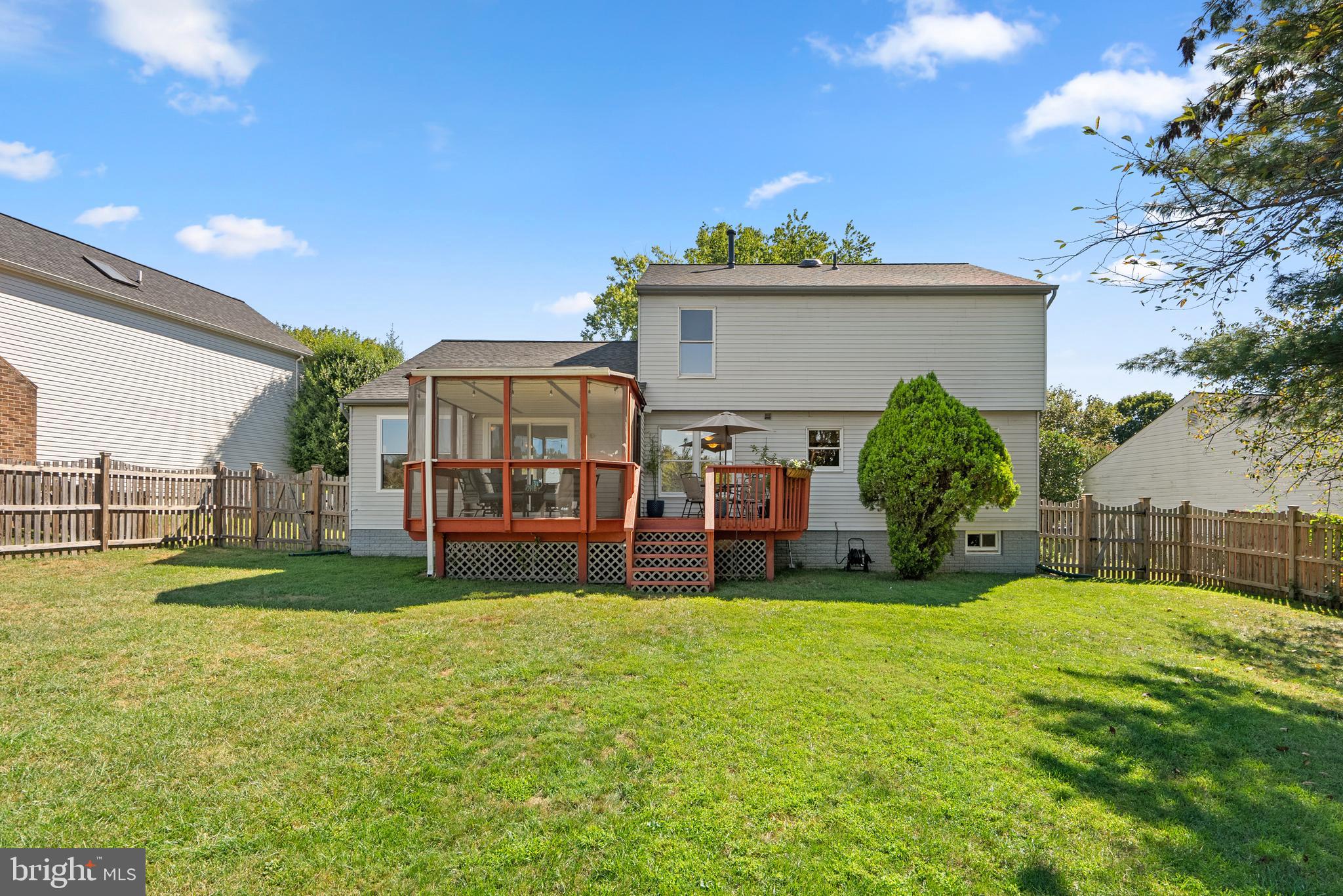 1949 Autumn Ridge Circle Silver Spring, MD 20906 - Photo 23 of 27 a view of a house with a big yard and potted plants